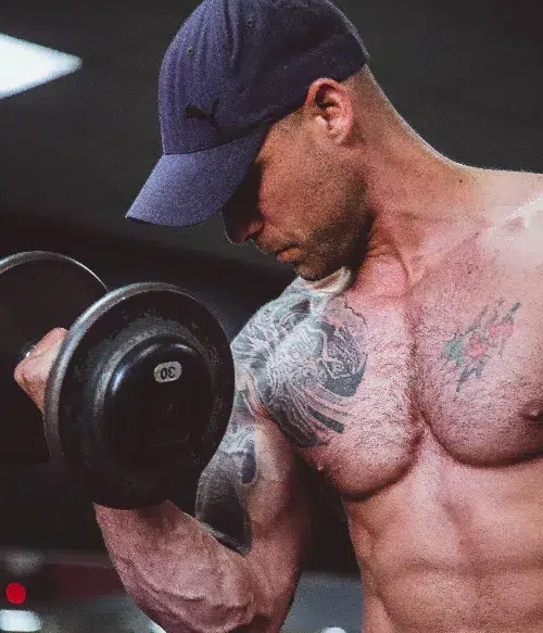 man with lean body doing bicep curls