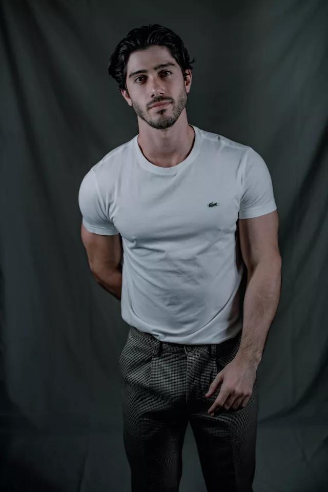 how to dress more masculine - man in t shirt and suit pants